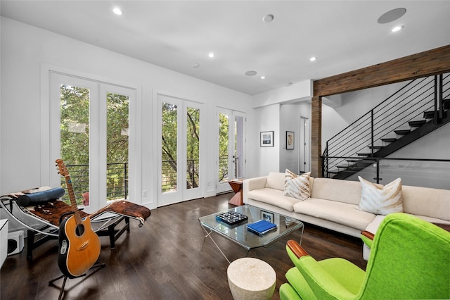 living area with a healthy amount of sunlight, stairs, wood finished floors, and recessed lighting