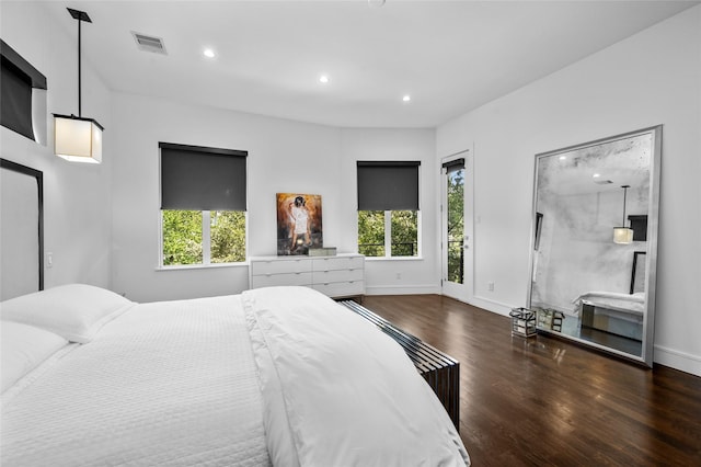 bedroom with multiple windows, visible vents, wood finished floors, and recessed lighting