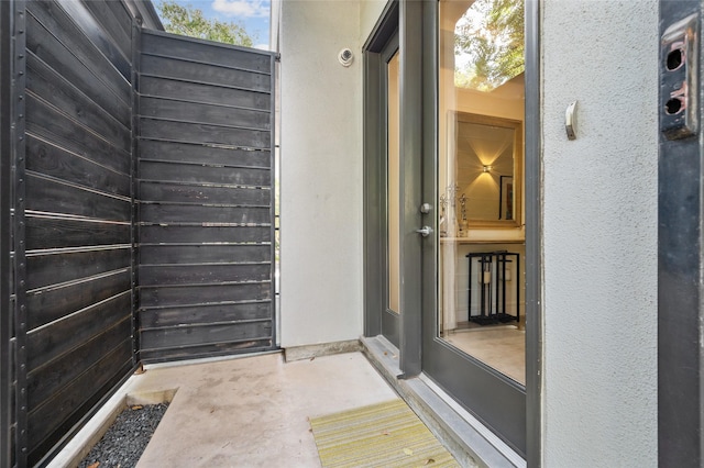 doorway to property with stucco siding