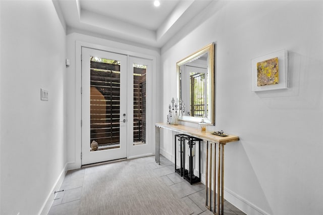 entryway with baseboards, french doors, and a healthy amount of sunlight