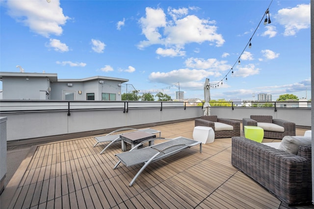 wooden terrace featuring an outdoor living space