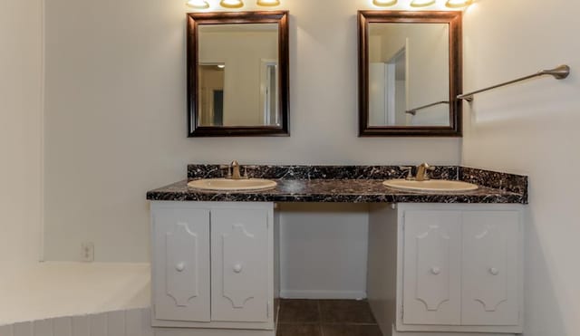 full bath with tile patterned floors, a sink, and double vanity