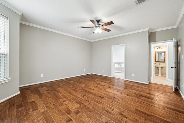 unfurnished bedroom with ensuite bathroom, baseboards, and wood-type flooring