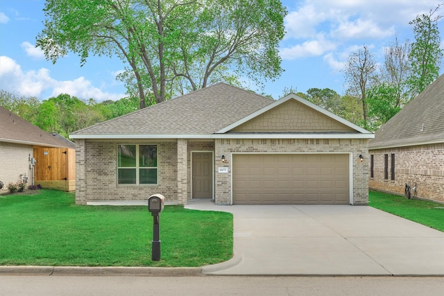 ranch-style home with driveway, an attached garage, a shingled roof, a front yard, and brick siding