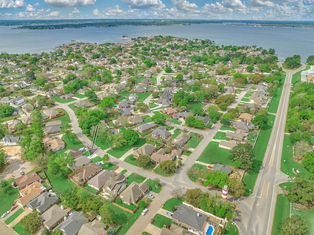 bird's eye view featuring a residential view and a water view