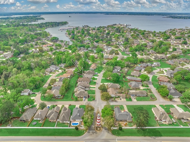 birds eye view of property with a residential view and a water view