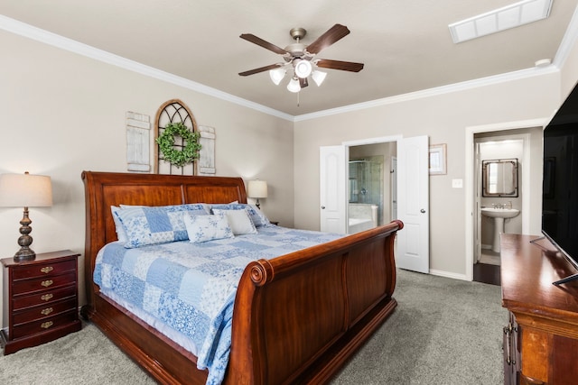 bedroom featuring carpet floors, crown molding, visible vents, a sink, and ensuite bath