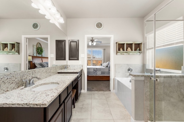 full bathroom featuring tile patterned flooring, connected bathroom, a sink, and double vanity