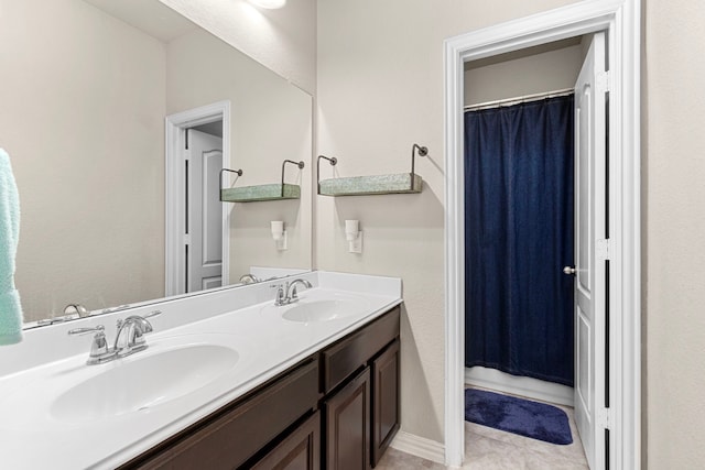 full bathroom with double vanity, a shower with curtain, and a sink