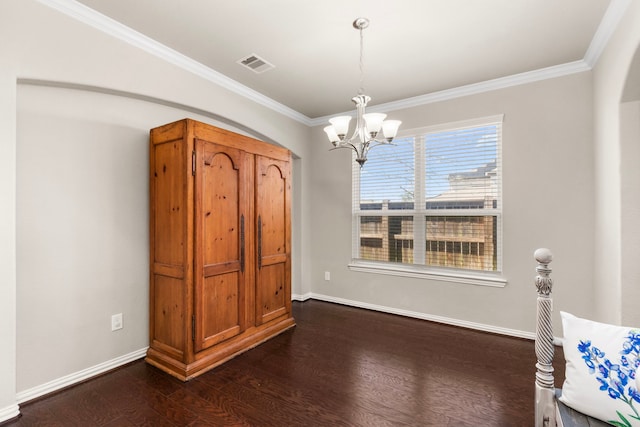 unfurnished dining area with a chandelier, visible vents, baseboards, dark wood finished floors, and crown molding