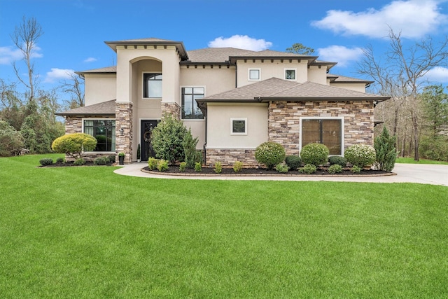 view of front of house featuring stone siding, roof with shingles, a front lawn, and stucco siding