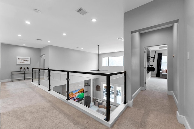 hall featuring carpet floors, recessed lighting, visible vents, an upstairs landing, and baseboards