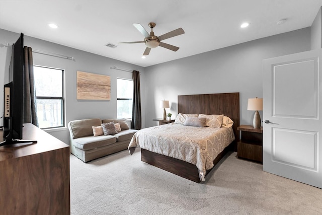 bedroom featuring a ceiling fan, recessed lighting, light carpet, and visible vents