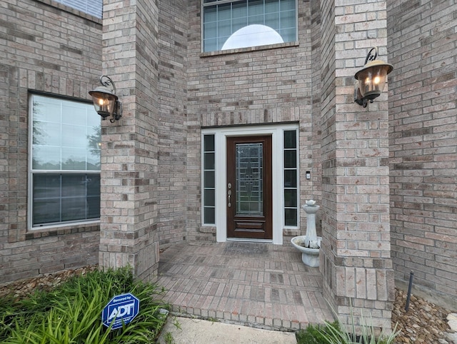 entrance to property with brick siding