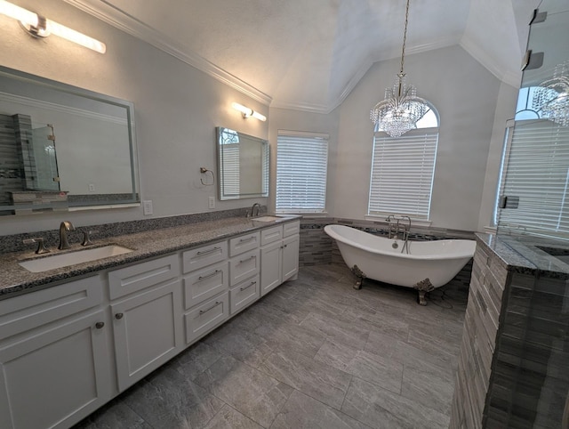 full bathroom featuring lofted ceiling, a soaking tub, double vanity, and a sink