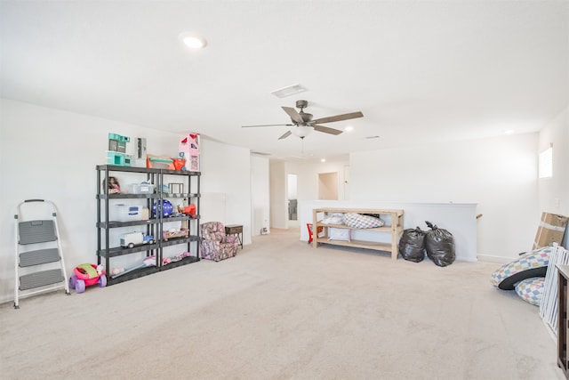 carpeted bedroom featuring ceiling fan, visible vents, and baseboards