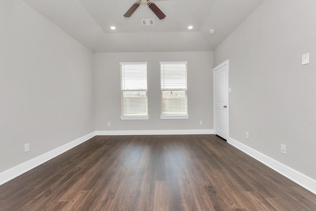 empty room with dark wood finished floors, recessed lighting, visible vents, a ceiling fan, and baseboards