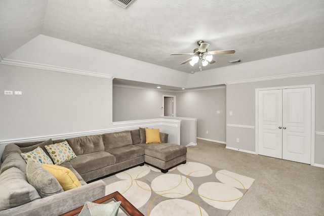 living room featuring light colored carpet, visible vents, a ceiling fan, ornamental molding, and baseboards