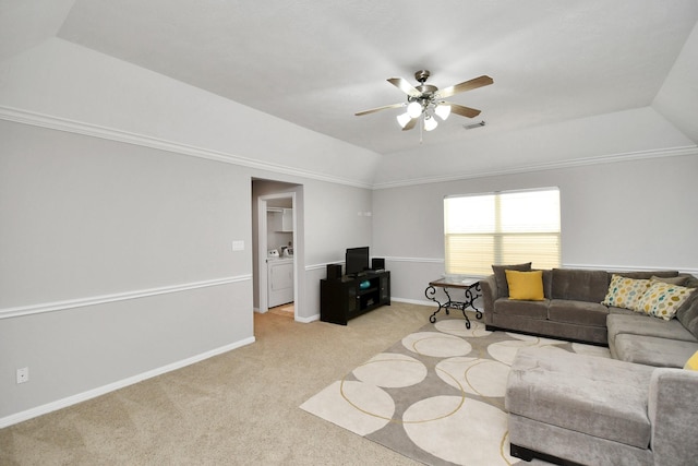 living room featuring lofted ceiling, light colored carpet, visible vents, washer / dryer, and baseboards