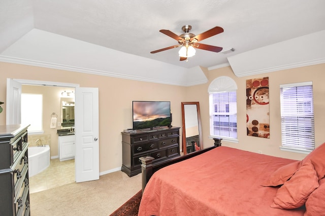 bedroom featuring crown molding, visible vents, light carpet, connected bathroom, and ceiling fan