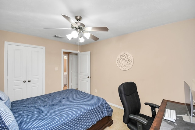 bedroom with ceiling fan, carpet flooring, visible vents, baseboards, and a closet