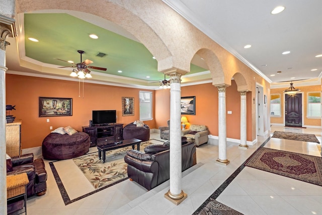 2732 Broadway St, San Leon, TX 77539 - living room with ornate columns, inlaid floor details, ornamental molding, ceiling fan, and tile patterned floors