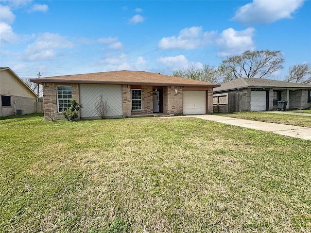 8611 Deep Valley Dr, Houston, TX 77044 - ranch-style house featuring brick siding, concrete driveway, central AC, a garage, and a front lawn