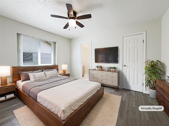8611 Deep Valley Dr, Houston, TX 77044 - bedroom with a ceiling fan, connected bathroom, a textured ceiling, and wood finished floors