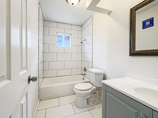 8611 Deep Valley Dr, Houston, TX 77044 - bathroom featuring a textured ceiling, tile patterned flooring, toilet, vanity, and shower / washtub combination