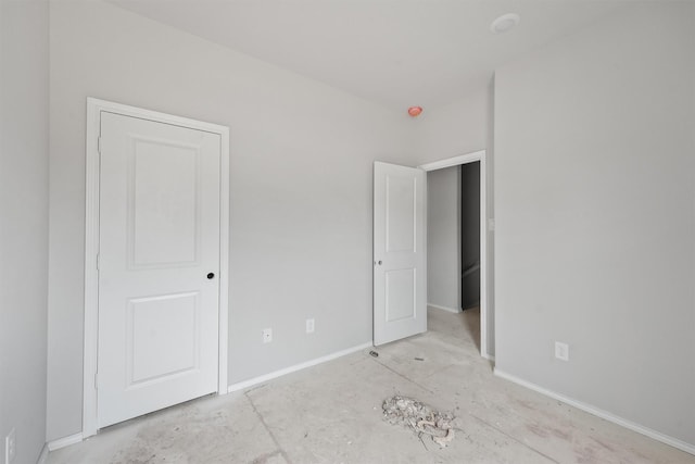 unfurnished bedroom with baseboards