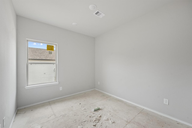 empty room with visible vents and baseboards