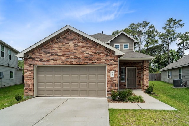 view of front facade with brick siding, concrete driveway, central AC unit, a front yard, and a garage