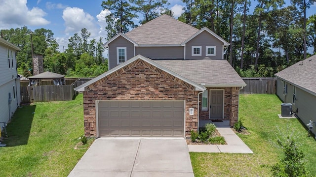 view of front of house featuring central air condition unit, brick siding, fence, concrete driveway, and a front lawn