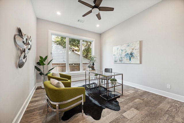 home office featuring wood finished floors, visible vents, and baseboards