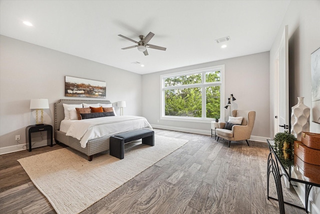 bedroom featuring recessed lighting, wood finished floors, visible vents, and baseboards