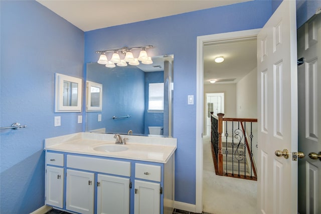 bathroom featuring baseboards and vanity