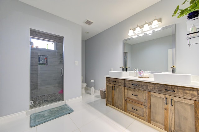 full bathroom with toilet, a sink, visible vents, and a shower stall