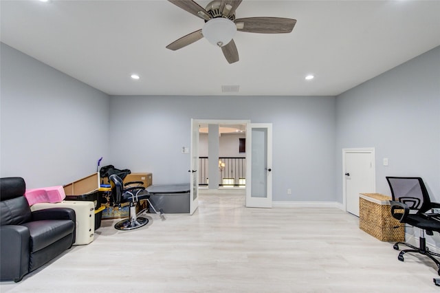 home office featuring light wood-type flooring, recessed lighting, visible vents, and french doors