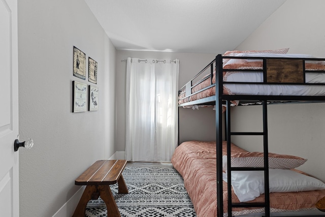 bedroom featuring vaulted ceiling