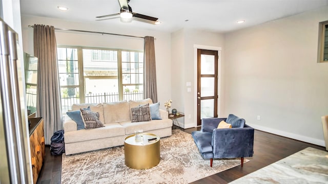 living room with a ceiling fan, recessed lighting, baseboards, and wood finished floors