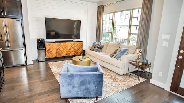 living area with dark wood finished floors and baseboards