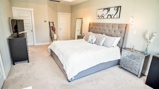 bedroom featuring carpet, visible vents, and baseboards