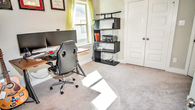 carpeted office with baseboards