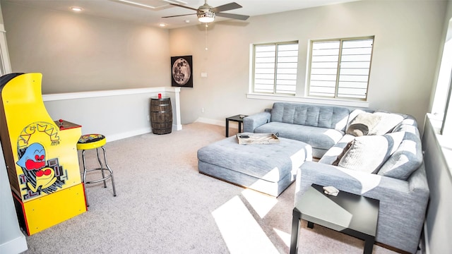 living room featuring carpet floors, ceiling fan, baseboards, and recessed lighting