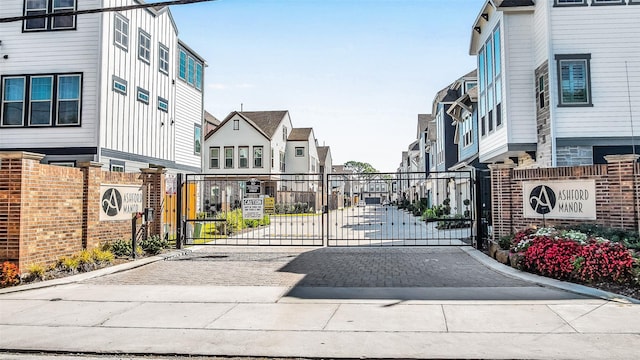 view of gate with a residential view