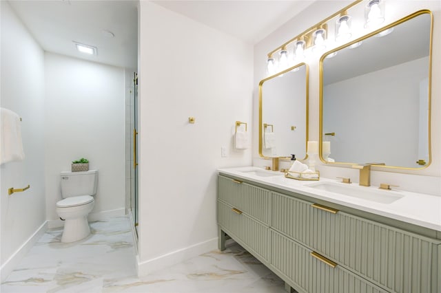 full bath with toilet, marble finish floor, baseboards, and a sink