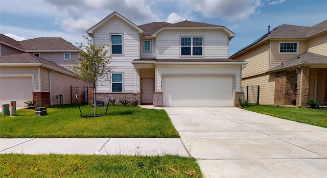 view of front of home with a front yard, driveway, an attached garage, and fence