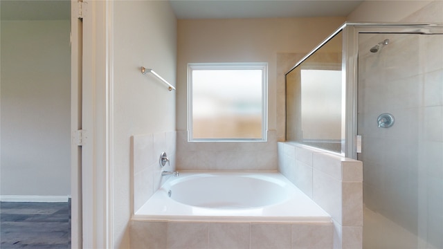 full bath featuring a shower stall and a bath