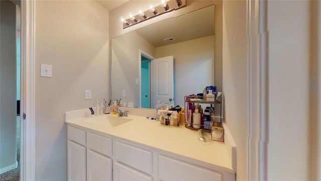 bathroom featuring visible vents and vanity