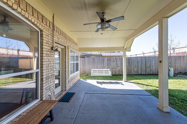 view of patio / terrace featuring a ceiling fan and fence